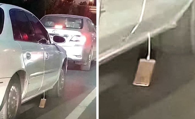 Un automobiliste qui laisse traîner sur la route son iPhone qui charge.